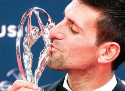  ?? VALERY HACHE/AFP ?? Laureus World Sportsman of The Year 2019 winner Serbia’s tennis player Novak Djokovic poses with his award at the 2019 Laureus World Sports Awards ceremony at the Sporting Monte-Carlo complex in Monaco on Monday.