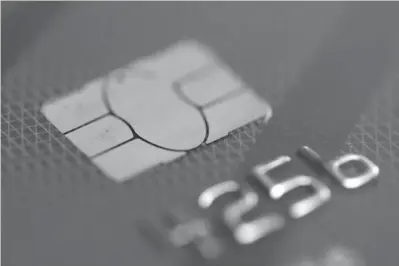  ?? Associated Press file
photo ?? ABOVE:
A credit card is shown June 10, 2015, in Philadelph­ia. A growing number of credit card companies are using artificial intelligen­ce software to persuade customers to use their credit card points in a certain way, be it redeeming their points for...