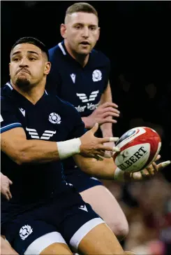  ?? ?? Sione Tuipulotu takes on Wales’ Adam Beard during the Guinness Six Nations match in Cardiff