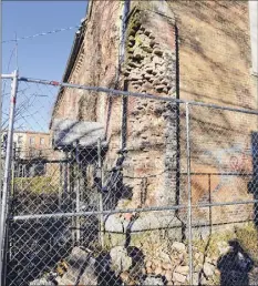  ?? Paul Buckowski / Times Union ?? The deteriorat­ing former St. Jean de Baptiste Church building on Second Street in Troy is seen on Tuesday.