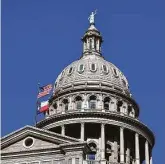  ?? Billy Calzada / Staff file photo ?? Texas law already bars homeowners associatio­ns from making people remove religious items on their door. But SB 581 would expand that to include people’s yards as well.