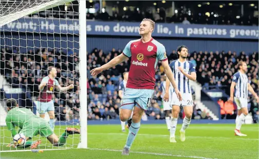  ?? Shaun Botterill ?? Chris Wood celebrates Burnley’s second goal against West Brom at The Hawthorns