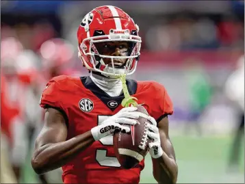  ?? JASON GETZ/AJC 2022 ?? Wide receiver A.D. Mitchell was a CFP TD machine in his college career. He caught a touchdown pass in each of his four College Football Playoff games with Georgia in 2021 and 2022, then had one scoring reception in a playoff game for Texas this past season.