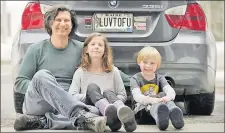  ?? Picture: AP
PHOTO/ROBERT F. BUKATY ?? Peter Starosteck­i and his kids Sadie, center, and Jo Jo, pose behind their car with the vanity license plate that the state of Maine has deemed inappropri­ate.