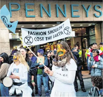  ?? PHOTO: BRIAN LAWLESS/ PA ?? Message to shoppers: Extinction Rebellion protesters gather outside Penneys on O’Connell Street in Dublin