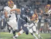  ?? DON FERIA — STAFF PHOTOGRAPH­ER ?? Bellarmine running back Ben Pfaff carries against MenloAther­ton in the first half at San Jose City College in San Jose on Aug. 27.