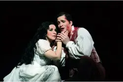  ??  ?? Angela Gheorghiu as Tosca and Riccardo Massi as Cavaradoss­i in Jonathan Kent’s production of Tosca, 2016