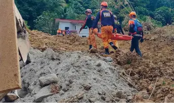  ?? — AFP photo ?? This handout photo obtained from the Facebook page of the Office of the Provincial Fire Marshal (OPFM) Davao de Oro shows responders conducting rescue operations at the site of a landslide in Maco, Davao de Oro.