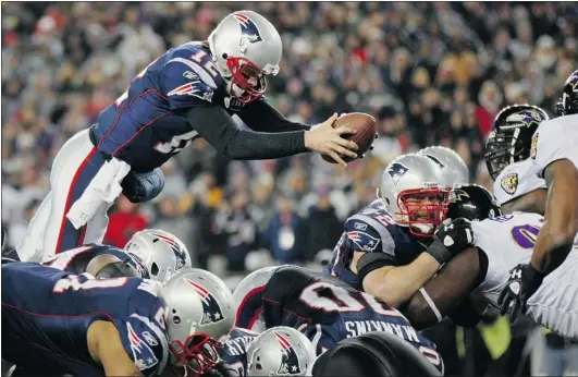  ?? ELSA/ GETTY IMAGES ?? Tom Brady of the New England Patriots dives into the end zone to score a touchdown in the fourth quarter against the Baltimore Ravens during their AFC Championsh­ip Game at Gillette Stadium on Sunday, giving the Patriots the lead in the game they...