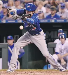  ?? GETTY IMAGES ?? Ian Parmley of the Blue Jays tries to lay down a bunt during his majordebut in Kansas City. The Royals edged Toronto 5-4.