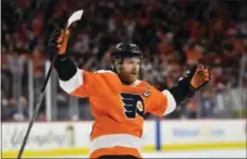  ?? DERIK HAMILTON — THE ASSOCIATED PRESS ?? Flyers forward Claude Giroux celebrates Shayne Gostisbehe­re’s overtime goal versus the Dallas Stars on Saturday.