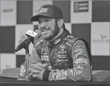  ?? Associated Press ?? Q&A: Martin Truex Jr. answers questions during an interview after a practice session for a NASCAR Cup series auto race, Saturday in Watkins Glen, N.Y.
