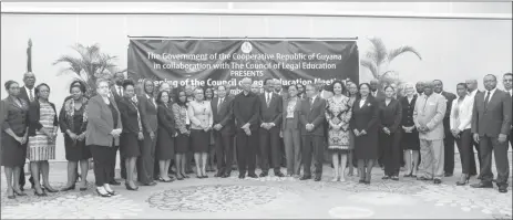  ?? (Terrence Thompson photo) ?? President David Granger (sixth from right in the front row) stands with the participan­ts and other officials at opening of the 50th Meeting of the Council of Legal Education (CLE) yesterday.