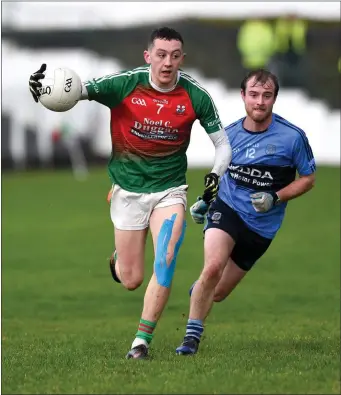  ??  ?? Sean O’Leary, Kilcummin chased by Alan Fitzsimmon­s, Kilmacthom­as in the Munster GAA Intermedia­te Championsh­ip in Kilcummin earlier this month Photo by Michelle Cooper Galvin