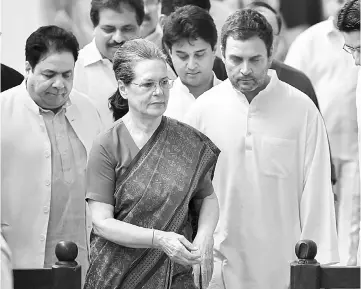  ??  ?? File photo shows Sonia and Rahul (right) leaving after casting their votes to elect the next Indian president at Parliament House on July 17. — AFP photo