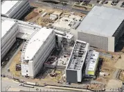  ?? JOE AMON / DENVER POST ?? This is an aerial photo from April of the VA hospital being built in Aurora, Colo. The facility originally was to cost $328 million, but the figure has skyrockete­d to $1.7 billion, and the VA is scrambling to find money. See a photo gallery with this...