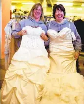  ??  ?? Shoppers try on wedding dresses at the store, where items usually go for 20 to 80 percent of retail.
