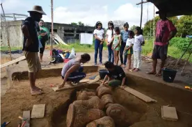  ??  ?? Archaeolog­ist unearth urns buried near from the community school in Tauary, in the Brazilian Amazon. Photograph: Mamirauá Institute