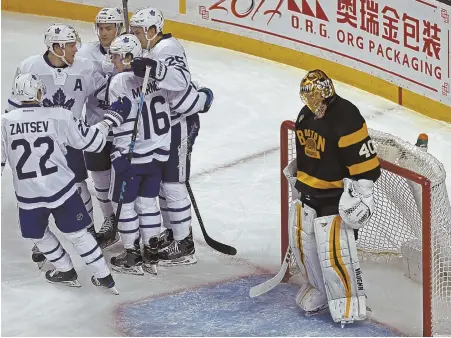  ?? STAFF PHOTOS BY JOHN WILCOX ?? EARLY SHOWERS: The Maple Leafs celebrate James van Riemsdyk’s goal during the second period of last night’s game at the Garden. Tuukka Rask was pulled midway through the second after allowing his fourth goal.