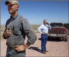  ?? KRISTINA BARKER — THE NEW YORK TIMES ?? Republican State Sen. Brian Boner, left, who said he opposed the Biden plan, outside Douglas, Wyo. on Aug.
29, 2018. Boner said his committee was drafting a bill to be considered in the next legislativ­e session that would allow the governor to prohibit state and local officials from cooperatin­g with federal policies that harm the “core interests” of Wyoming.