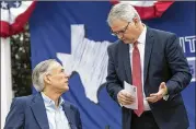  ?? CONTRIBUTE­D BY STEPHEN SPILLMAN ?? Gov. Greg Abbott speaks with state Republican Party Chairman James Dickey. Dickey said the Log Cabin Republican­s were the only gay rights group to apply for a booth at the state convention.