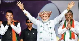  ??  ?? Prime Minister Narendra Modi, Maharashtr­a Chief Minister Devendra Fadnavis and newly appointed BJP member Udayanraje Bhosle during the 'Vijay Sankalp Rally' in Nashik, Thursday