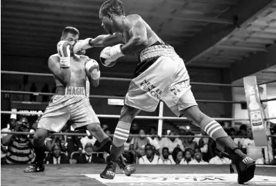  ?? GLADSTONE TAYLOR/MULTIMEDIA PHOTO EDITOR ?? Richard Frog Holmes (right) fights in the 2018 Wray and Nephew Contender final against Ricardo ‘Magic Man’ Salas.