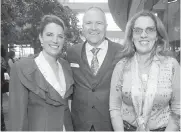  ??  ?? Natasha Crawford of Brown’s The Florist, Wilson’s Transporta­tion president John Wilson and Shellie Gudgeon, owner of Il Terrazzo.