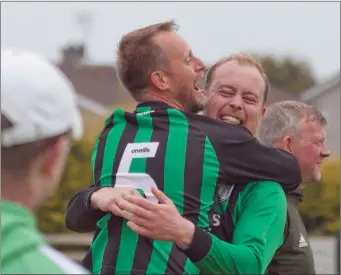  ??  ?? Arklow United players celebrate after clinching the Division 3 title.