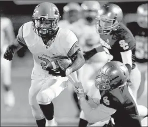  ?? Special to NWA Media/DAVID J. BEACH ?? Warren running back Trent Broughton (left) rushed for 127 yards and 2 touchdowns in the Lumberjack­s’ Class 4A quarterfin­al victory at Shiloh Christian last Friday. The Lumberjack­s are the last team to beat Dardanelle, eliminatin­g the Sand Lizards in the second round last season.