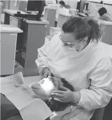  ?? PHOTOS: DAWN VILLELLA/THE ASSOCIATED PRESS/FILES ?? Dental therapists perform procedures that go beyond dental hygiene, such as fillings.