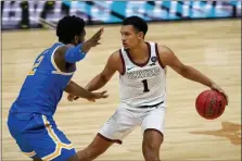  ?? MICHAEL CONROY — THE ASSOCIATED PRESS ?? Gonzaga guard Jalen Suggs looks to drive around UCLA forward Cody Riley during the second half of a men’s Final Four semifinal game at Lucas Oil Stadium in Indianapol­is on April 3.