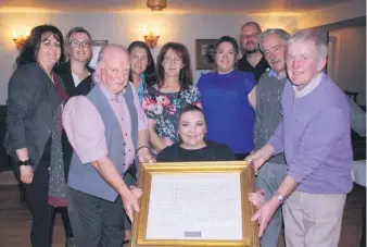  ??  ?? Pictured at the presentati­on of the framed document of ‘The Drummer Boy’, which took place at the Galtee View Lounge, Anglesboro, l-r: Carmel Quirke, Mary T. O’Donnell, Michael Cleary making the presentati­on; Rica Dishong, Denver, USA; Sue Cleary, Sinead Cleary, Brian Cleary, John Allen and Patrick English. In front: Kate Cleary Nelson, Denver, USA. Michael Cleary is a grandchild, while Kate and Brian are great-grandchild­ren of Hannie Condon Cleary, as mentioned in the article.