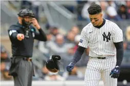  ?? SETH WENIG/AP ?? New York Yankees’ Juan Soto slams his helmet on the ground after striking out during the eighth inning of a game against the Toronto Blue Jays at Yankee Stadium on Friday in New York.