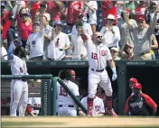  ?? NICK WASS — THE ASSOCIATED PRESS ?? Washington’s Kyle Schwarber takes a curtain call after hitting a two-run home run in the seventh inning Sunday.