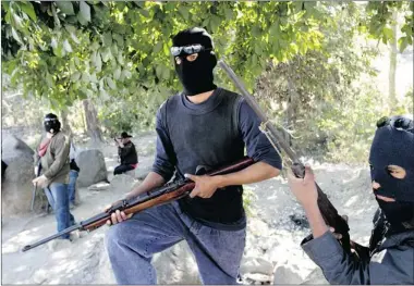  ?? PEDRO PARDO/ AFP/GETTY IMAGES ?? Residents in Tecoanapa, in the Mexican state of Guerrero, take justice into their own hands to try to combat gang violence.