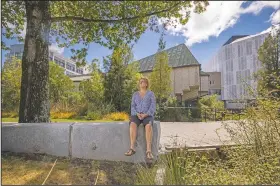  ?? (AP/Peter Meecham) ?? Ann Brower, the lone survivor from a bus which was hit by falling debris from a building during the Christchur­ch earthquake 10 years ago, sits at her workplace in Christchur­ch.