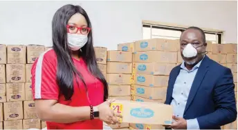  ??  ?? L-R Charity-ilevbare-adeniji, Head of personal Care, PZ Cussons; Olusegun Ogboye, Permanent Secretary Lagos State Ministry of Health, at the presentati­on of products by PZ Cussons Foundation to Lagos state in support of the fight against the spread of COVID-19 in Lagos recently.