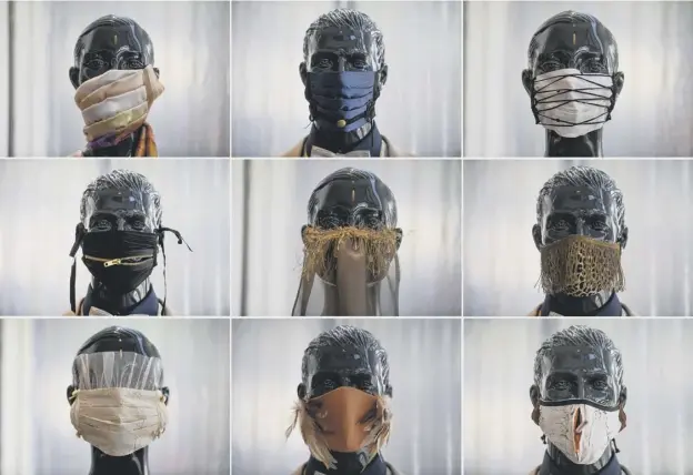  ??  ?? 0 ‘Fashionabl­e’ protective face masks go on display at a studio in Krefeld in Germany - 10 per cent of the sales goes to charity