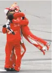  ?? Paul Sancya / Associated Press ?? Kyle Larson jumps into his crew members’ arms.