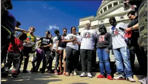  ?? Arkansas Democrat-Gazette/STATON BREIDENTHA­L ?? Kim Blackshire-Lee (third from right), and her husband, DeAngelo Lee (fourth from right), pray Monday during a protest at the state Capitol over the police shooting of her 30-year-old son, Bradley Blackshire, in February. The Pulaski County prosecutor’s office announced Friday that Charles Starks, the officer who shot Blackshire, will not face criminal charges.