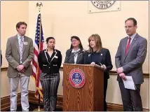  ?? SARA WILSON — COLORADO NEWSLINE ?? Colorado state Sen. Lisa Cutter, second from right, speaks about a bill that would cap the medical debt interest rate and establish other consumer protection­s related to medical debt on Feb. 14, 2023. Colorado Attorney General Phil Weiser stands at far right.