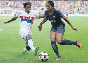  ?? NICK POTTS/PA VIA AP ?? Lyon’s Kadeisha Buchanan, left, and Paris Saint-Germain’s Ashley Lawrence battle for the ball during the Women’s Champions League Final soccer match at the Cardiff City Stadium in Cardiff, Wales, Thursday.