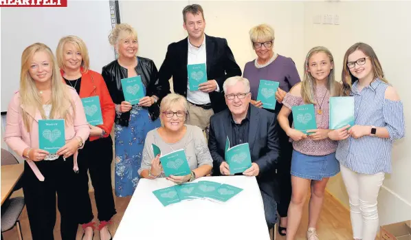  ??  ?? Charity champion Roberta, seated, with husband Robert and L-R Carly Young, Gaynor Young, Sheila Hood, Derek Young, Iris Mitchell, Lois Hood and Libby Young