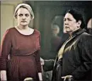  ?? GEORGE KRAYCHYK/HULU ?? Elisabeth Moss, left, and Ann Dowd in “The Handmaid's Tale,” an outstandin­g drama series nominee. Peter Dinklage, of “Game of Thrones,” got a supporting actor nod.