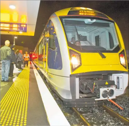  ?? Photo / Greg Bowker ?? One of Auckland’s new electric trains at Britomart in Auckland. A proposed new service from Hamilton will take commuters to catch the electric train in Papakura.