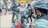  ?? REUTERS ?? Anti-government demonstrat­ors scuffle with riot police as a second reading of a national anthem law takes place in Hong Kong.