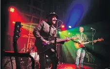  ??  ?? Colin Linden of Blackie and the Rodeo Kings entertaine­d the crowd in the barn Sunday night.