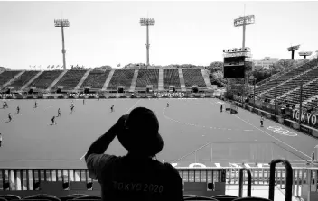  ?? AP ?? An Olympic worker watches the South African women’s field hockey team train at Oi Hockey Stadium ahead of the 2020 Summer Olympics in Tokyo yesterday.