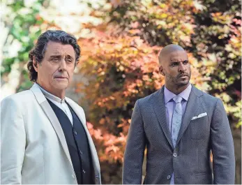  ?? STARZ ?? Mr. Wednesday (Ian McShane, left) reveals his true name to Shadow Moon (Ricky Whittle).